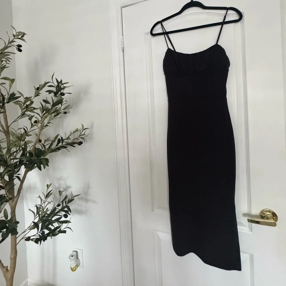 dynamite black dress Bandage Mini 55 Bodycon throughout the bodice with a column skirt Model is wearing size XS Materials Asymmetric Ruffle Midi Dress Black